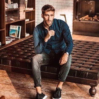Navy and White Polka Dot Long Sleeve Shirt Outfits For Men: This combination of a navy and white polka dot long sleeve shirt and charcoal jeans is on the casual side but is also stylish and seriously sharp. Complete this getup with a pair of black canvas low top sneakers and off you go looking killer.