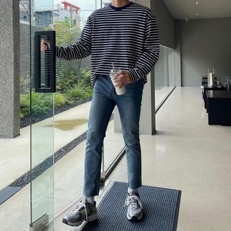 Navy Ripped Jeans Outfits For Men: Choose a navy and white horizontal striped long sleeve t-shirt and navy ripped jeans for a killer and trendy getup. Complete this look with silver athletic shoes and the whole outfit will come together.