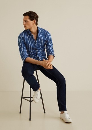 Blue Print Long Sleeve Shirt Outfits For Men: Such staples as a blue print long sleeve shirt and navy jeans are an easy way to introduce toned down dapperness into your day-to-day collection. For extra style points, introduce a pair of white canvas low top sneakers to the mix.