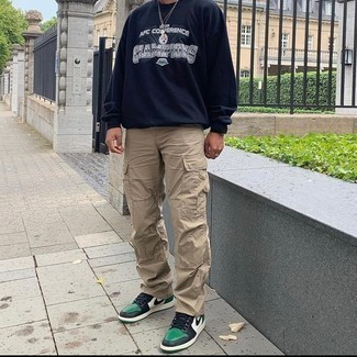 Khaki Cargo Pants Outfits: A navy and white print sweatshirt and khaki cargo pants have become true casual styles for most guys. A pair of green leather low top sneakers integrates effortlessly within a great deal of combos.