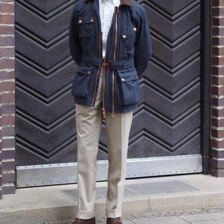 Navy and Green Barn Jacket Outfits: For an outfit that's classic and camera-worthy, reach for a navy and green barn jacket and beige dress pants. Bring a mellow vibe to your look by finishing off with brown leather desert boots.