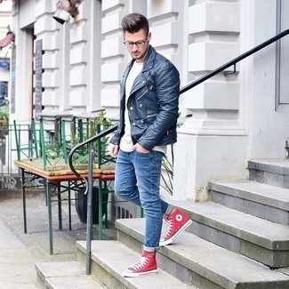 Navy Leather Biker Jacket Outfits For Men: The versatility of a navy leather biker jacket and blue skinny jeans guarantees they'll always be on constant rotation. Complement your ensemble with red canvas high top sneakers and the whole getup will come together.