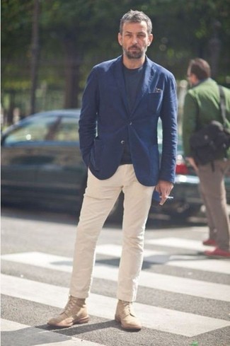 Tan Casual Boots Outfits For Men: Make a bold statement anywhere you go in a navy blazer and beige chinos. When in doubt about what to wear on the footwear front, introduce a pair of tan casual boots to the equation.