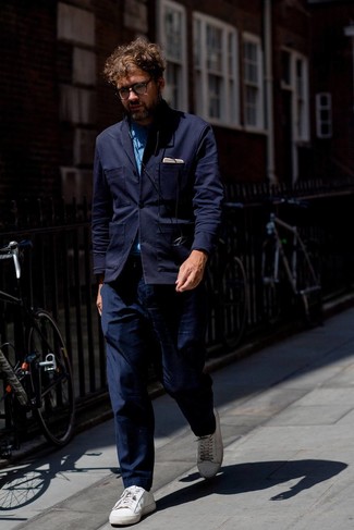 Navy Knit Blazer Outfits For Men: A navy knit blazer and navy chinos matched together are the ideal combo for guys who prefer casually classy styles. And if you want to easily dial down this ensemble with one item, why not add white leather low top sneakers to the equation?