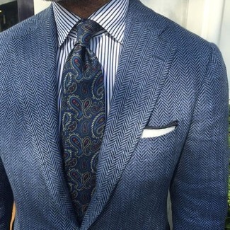 Blue Paisley Tie Outfits For Men: This combo of a navy herringbone wool blazer and a blue paisley tie spells rugged elegance.