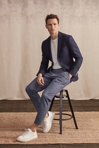Navy Blazer Casual Outfits For Men: Consider pairing a navy blazer with blue chinos to pull together a casually classic and modern-looking outfit. Want to go easy on the shoe front? Add white leather low top sneakers to the equation for the day.