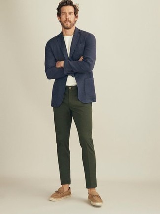 Tan Suede Loafers Outfits For Men: This smart casual pairing of a navy blazer and dark green chinos is very easy to pull together without a second thought, helping you look amazing and ready for anything without spending too much time going through your wardrobe. Introduce a pair of tan suede loafers to the equation to completely change up the outfit.