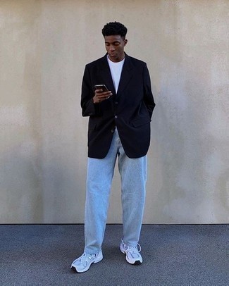 Navy Blazer Casual Outfits For Men: A navy blazer and light blue jeans matched together are a match made in heaven. Up this whole look by finishing with a pair of white athletic shoes.