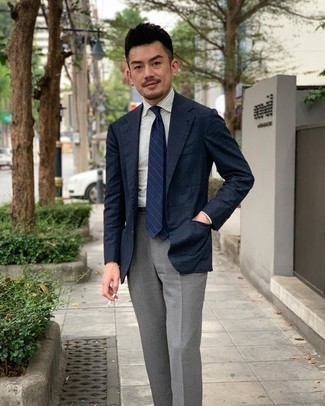 Navy Blazer Summer Outfits For Men: You're looking at the undeniable proof that a navy blazer and grey dress pants look awesome when paired together in a classy ensemble for a modern dandy. It is indeed possible to look easy breezy under the unbearable heat. The proof is right here
