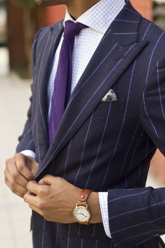 Swing into something smart yet contemporary in a navy vertical striped blazer and a white dress shirt.