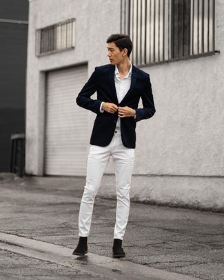 White Ripped Jeans Outfits For Men: This pairing of a navy blazer and white ripped jeans is hard proof that a straightforward off-duty look can still be really interesting. With shoes, go down a more elegant route with a pair of black suede chelsea boots.