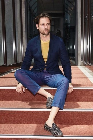 Yellow Crew-neck Sweater Outfits For Men: When the setting allows a relaxed look, try pairing a yellow crew-neck sweater with blue chinos. Puzzled as to how to finish off this outfit? Wear black print canvas tassel loafers to step up the fashion factor.
