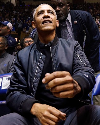 Barack Obama wearing Navy Bomber Jacket, Black Crew-neck Sweater, Black Vertical Striped Long Sleeve Shirt, Charcoal Chinos