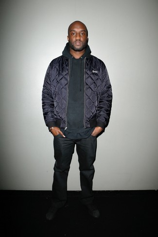 Virgil Abloh wearing Navy Quilted Bomber Jacket, Black Hoodie, Black Jeans, Black Low Top Sneakers