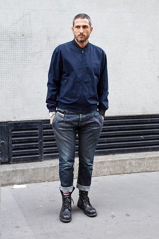 If you like a more laid-back approach to style, why not consider wearing a navy bomber jacket and navy jeans? Bump up the cool of this outfit by slipping into black leather casual boots.