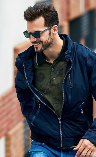 Dark Green Polo Outfits For Men: This off-duty combination of a dark green polo and blue ripped jeans is a surefire option when you need to look dapper in a flash.
