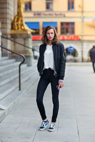 Blue Bomber Jacket Outfits For Women: Go for a straightforward yet edgy and casual look teaming a blue bomber jacket and black skinny jeans. Navy low top sneakers are a welcome complement to your ensemble.