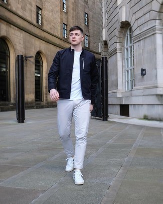 White and Black Leather Shoes with Pants Outfits For Men: This combo of a navy bomber jacket and pants is well-executed and yet it looks relaxed and ready for anything. If you want to break out of the mold a little, complete this getup with a pair of white and black leather low top sneakers.