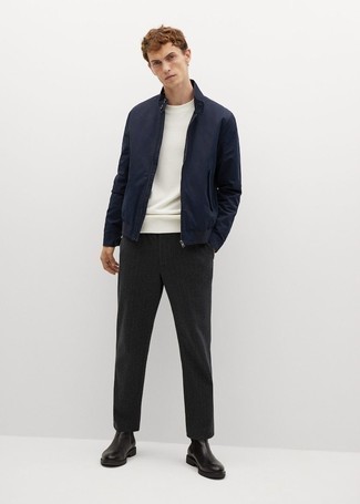 Black Vertical Striped Chinos Outfits: This on-trend outfit is so simple: a navy bomber jacket and black vertical striped chinos. Go the extra mile and shake up your look by rocking black leather chelsea boots.