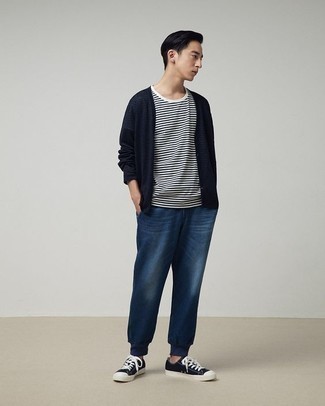 Blue Jeans with Cardigan Outfits For Men: This combo of a cardigan and blue jeans is the ideal balance between fun and stylish. Put a more casual spin on an otherwise traditional ensemble by wearing a pair of navy and white canvas low top sneakers.