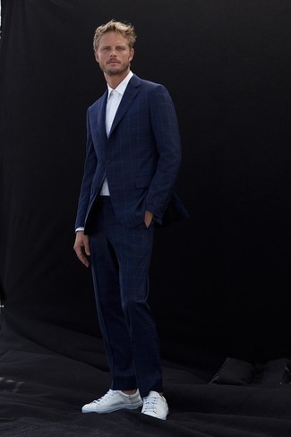 Navy Check Suit with White Leather Low Top Sneakers Outfits: This refined pairing of a navy check suit and a white dress shirt will prove your styling prowess. Round off with a pair of white leather low top sneakers to spice things up.