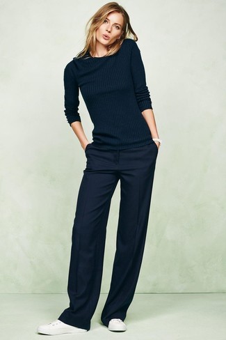 Navy Wide Leg Pants Outfits: Consider pairing a navy crew-neck sweater with navy wide leg pants to prove you've got expert styling prowess. Finishing with white leather low top sneakers is the simplest way to infuse a hint of stylish nonchalance into this look.