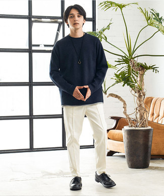 Navy Crew-neck Sweater Smart Casual Outfits For Men: Extremely stylish and functional, this laid-back combo of a navy crew-neck sweater and white chinos offers variety. If you want to feel a bit fancier now, add black leather derby shoes to the mix.