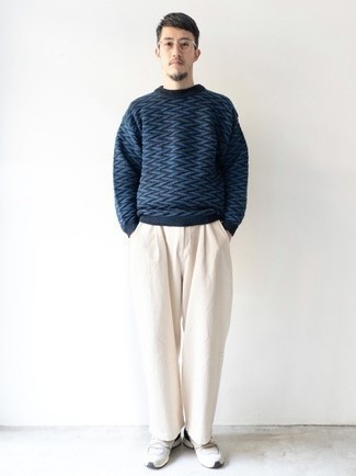 Men's Navy Chevron Crew-neck Sweater, White Chinos, White and Black Athletic Shoes, Clear Sunglasses
