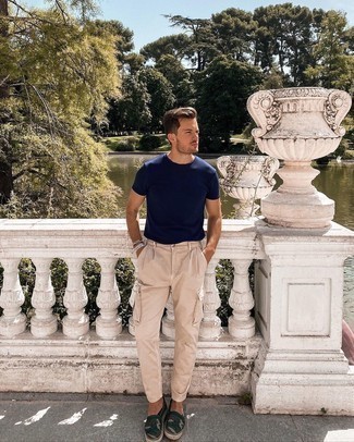 Beige Cargo Pants Outfits: A navy crew-neck t-shirt and beige cargo pants are an edgy pairing that every modern man should have in his off-duty styling routine. Complete this ensemble with dark green camouflage canvas espadrilles to completely switch up the outfit.