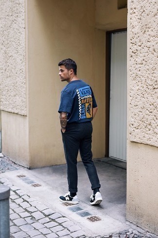 Navy Print Crew-neck T-shirt Outfits For Men: If you gravitate towards casual getups, why not try this combination of a navy print crew-neck t-shirt and navy chinos? A pair of black and white print canvas low top sneakers can integrate nicely within plenty of looks.