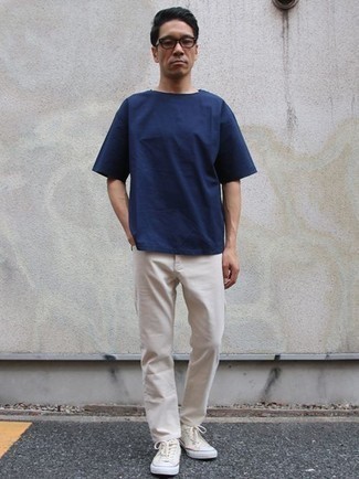 Men's Navy Crew-neck T-shirt, White Chinos, Beige Canvas Low Top Sneakers, Clear Sunglasses