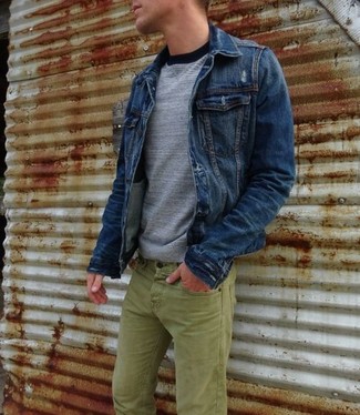 Teal Jeans Outfits For Men: Master the casually dapper look by opting for a navy denim jacket and teal jeans.