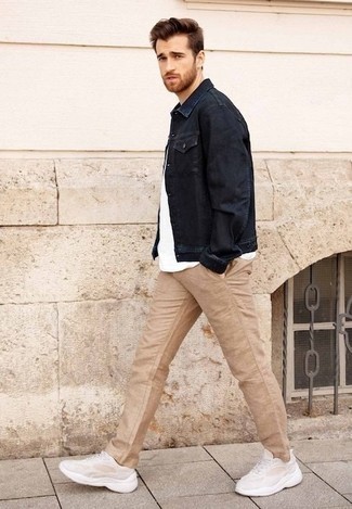 White and Black Crew-neck T-shirt with Denim Jacket Outfits For Men: This sharp getup is really pared down: a denim jacket and a white and black crew-neck t-shirt. With footwear, go for something on the laid-back end of the spectrum by slipping into beige athletic shoes.