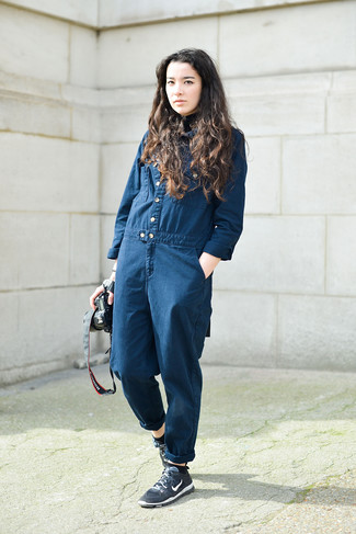 Blue Athletic Shoes Chill Weather Outfits For Women: Opt for a navy denim jumpsuit for a standout look. To bring out a sassier side of you, complete this outfit with blue athletic shoes.
