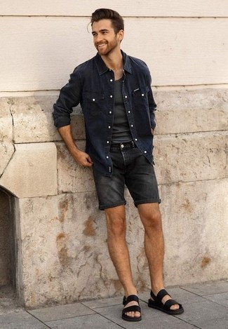 Charcoal Denim Shorts Outfits For Men: Marrying a navy denim shirt with charcoal denim shorts is an on-point pick for a laid-back yet seriously stylish getup. On the shoe front, go for something on the laid-back end of the spectrum by finishing off with a pair of black leather sandals.