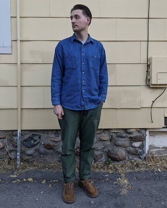Brown Suede Desert Boots Outfits: This combo of a navy denim shirt and dark green chinos is very easy to do and so comfortable to wear a variation of over the course of the day as well! The whole ensemble comes together really well if you add a pair of brown suede desert boots to the mix.