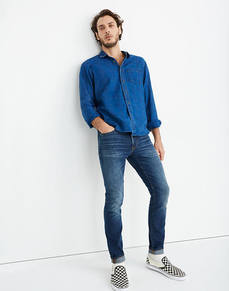 Navy Denim Shirt Outfits For Men: This off-duty combo of a navy denim shirt and navy jeans is extremely easy to put together in no time flat, helping you look amazing and ready for anything without spending too much time digging through your wardrobe. Black and white check canvas slip-on sneakers tie the outfit together.