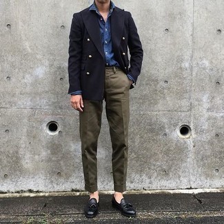 Navy Denim Shirt Outfits For Men: Wear a navy denim shirt and olive chinos if you want to look casually stylish without exerting much effort. And if you wish to effortlessly perk up this ensemble with one piece, complete your getup with a pair of black leather tassel loafers.