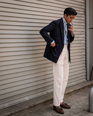 Beige Dress Pants Outfits For Men: We love the way this combination of a navy double breasted blazer and beige dress pants instantly makes you look sharp and elegant. Take a more laid-back approach with shoes and introduce dark brown leather tassel loafers to this outfit.