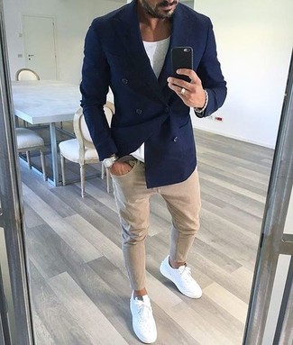 Men's Navy Double Breasted Blazer, White Crew-neck T-shirt, Beige Skinny Jeans, White Leather Low Top Sneakers