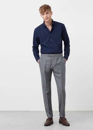 Navy Dress Shirt Outfits For Men: Teaming a navy dress shirt and grey dress pants will allow you to show off your styling savvy. You could perhaps get a little creative when it comes to footwear and add a pair of dark brown leather monks to the equation.