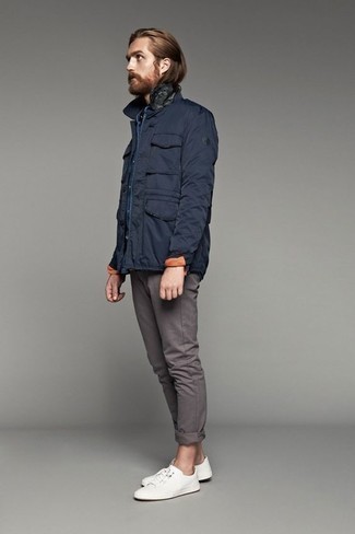 Navy Field Jacket Outfits: The combination of a navy field jacket and grey chinos makes this a solid laid-back look. Complete this getup with a pair of white canvas low top sneakers to keep the outfit fresh.