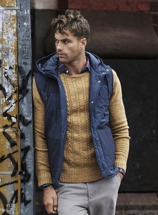 Blue Quilted Gilet Outfits For Men: A blue quilted gilet looks especially good when married with grey chinos.