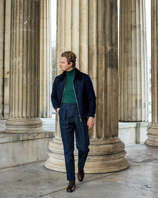 Dark Green Turtleneck Outfits For Men: A dark green turtleneck and navy dress pants are absolute essentials if you're putting together a stylish closet that matches up to the highest sartorial standards. Add dark brown leather oxford shoes to the mix to easily boost the wow factor of this outfit.