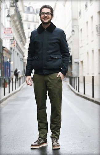 Men's Navy Harrington Jacket, Olive Chinos, Dark Brown Leather Casual Boots, Clear Sunglasses