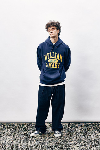 Blue Hoodie Outfits For Men: For an ensemble that's very straightforward but can be styled in many different ways, opt for a blue hoodie and navy jeans. Add navy and white canvas low top sneakers to the mix for extra fashion points.