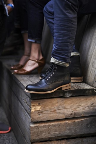 To assemble a casual ensemble with a twist, you can easily wear navy jeans. Why not enter a pair of black leather dress boots into the equation for a dash of class?