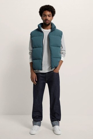 Men's White Canvas Low Top Sneakers, Navy Jeans, White and Black Horizontal Striped Long Sleeve T-Shirt, Teal Quilted Gilet