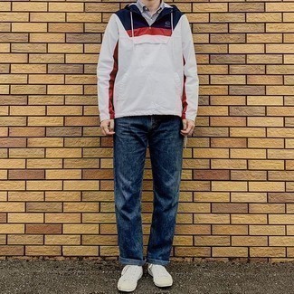 Men's White Canvas Low Top Sneakers, Navy Jeans, White and Navy Vertical Striped Short Sleeve Shirt, White and Red and Navy Windbreaker
