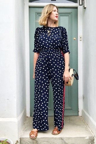 Navy Polka Dot Jumpsuit Outfits: Rock a navy polka dot jumpsuit for a stylish and laid-back look. Go ahead and introduce a pair of brown leather flat sandals to the equation for a more relaxed twist.